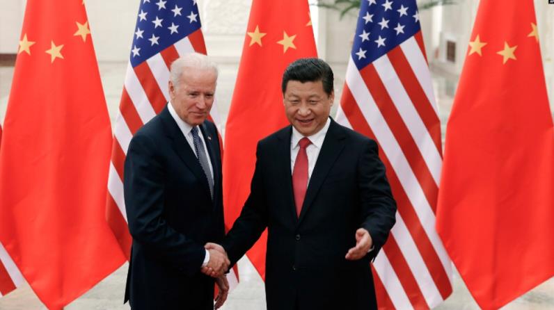 资料照：中国国家主席习近平与时任美国副总统的拜登在北京会面。(2013年12月4日) ... ... ...